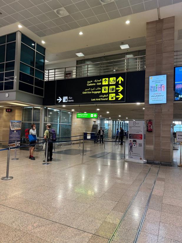 Airport guidance sign for passenger directions at Cairo International Airport