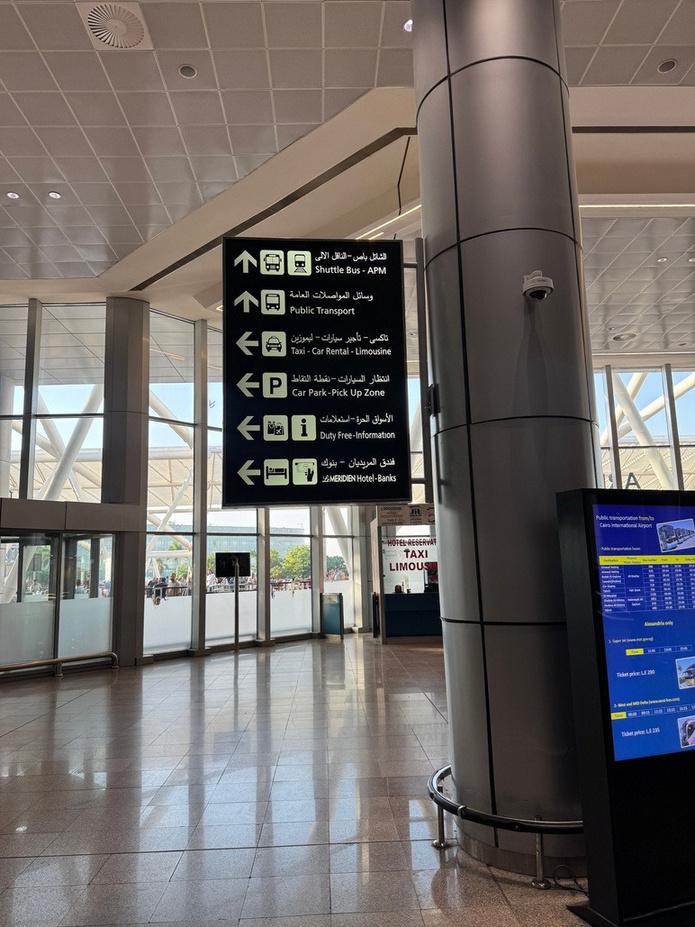 Interior airport directional signage display at Cairo International Airport